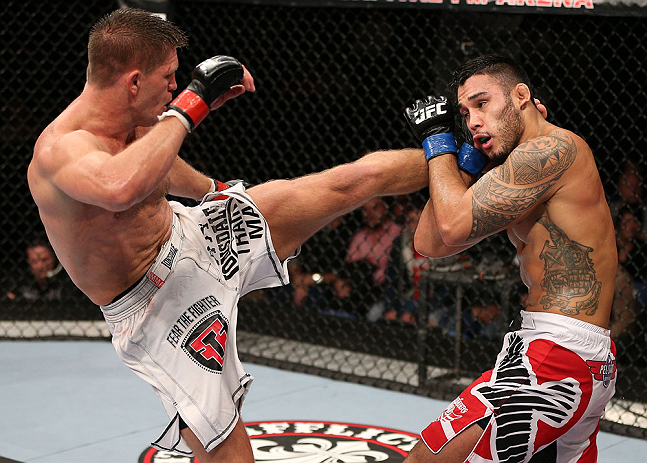NOTTINGHAM, ENGLAND - SEPTEMBER 29: (L-R) Tom Watson kicks Brad Tavares during their middleweight fight at the UFC on Fuel TV event at Capital FM Arena on September 29, 2012 in Nottingham, England. (Photo by Josh Hedges/Zuffa LLC/Zuffa LLC via Getty Images)