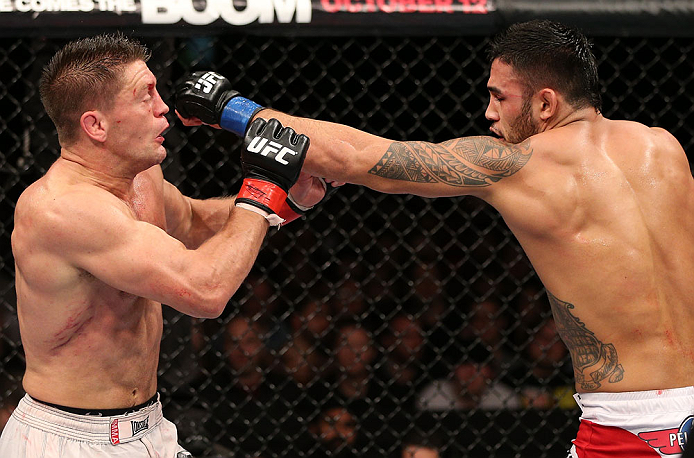 NOTTINGHAM, ENGLAND - SEPTEMBER 29: (R-L) Brad Tavares punches Tom Watson during their middleweight fight at the UFC on Fuel TV event at Capital FM Arena on September 29, 2012 in Nottingham, England. (Photo by Josh Hedges/Zuffa LLC/Zuffa LLC via Getty Images)