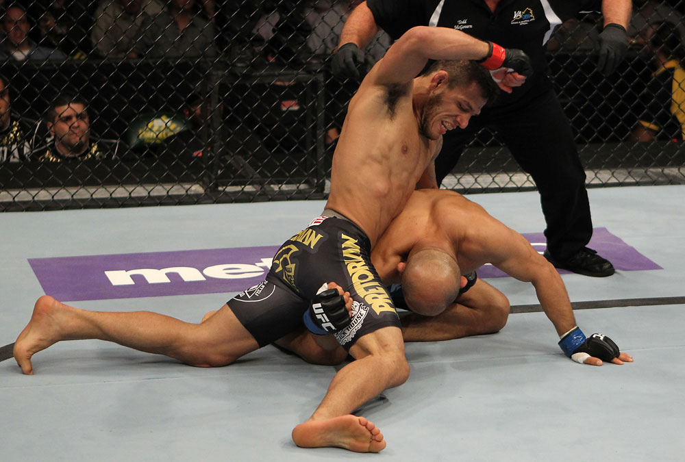 FAIRFAX, VA - MAY 15:  (L-R) Rafael Dos Anjos punches Kamal Shalorus in a lightweight bout during the UFC on Fuel TV event at Patriot Center on May 15, 2012 in Fairfax, Virginia.  (Photo by Josh Hedges/Zuffa LLC/Zuffa LLC via Getty Images)