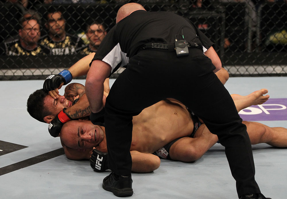 FAIRFAX, VA - MAY 15:  (L-R) Rafael Dos Anjos defeats Kamal Shalorus with a rear choke submisssion in a lightweight bout during the UFC on Fuel TV event at Patriot Center on May 15, 2012 in Fairfax, Virginia.  (Photo by Josh Hedges/Zuffa LLC/Zuffa LLC via Getty Images)