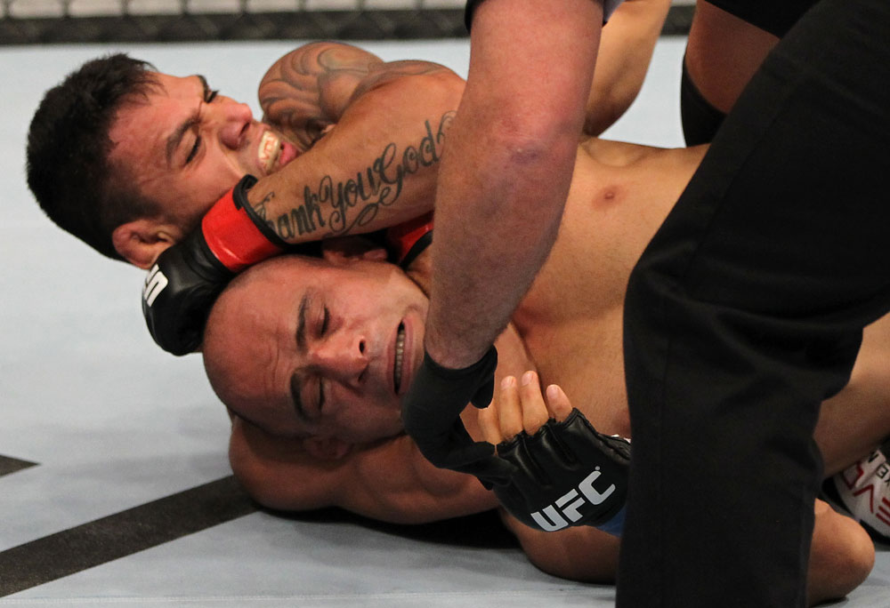 FAIRFAX, VA - MAY 15:  (L-R) Rafael Dos Anjos defeats Kamal Shalorus with a rear choke submisssion in a lightweight bout during the UFC on Fuel TV event at Patriot Center on May 15, 2012 in Fairfax, Virginia.  (Photo by Josh Hedges/Zuffa LLC/Zuffa LLC via Getty Images)