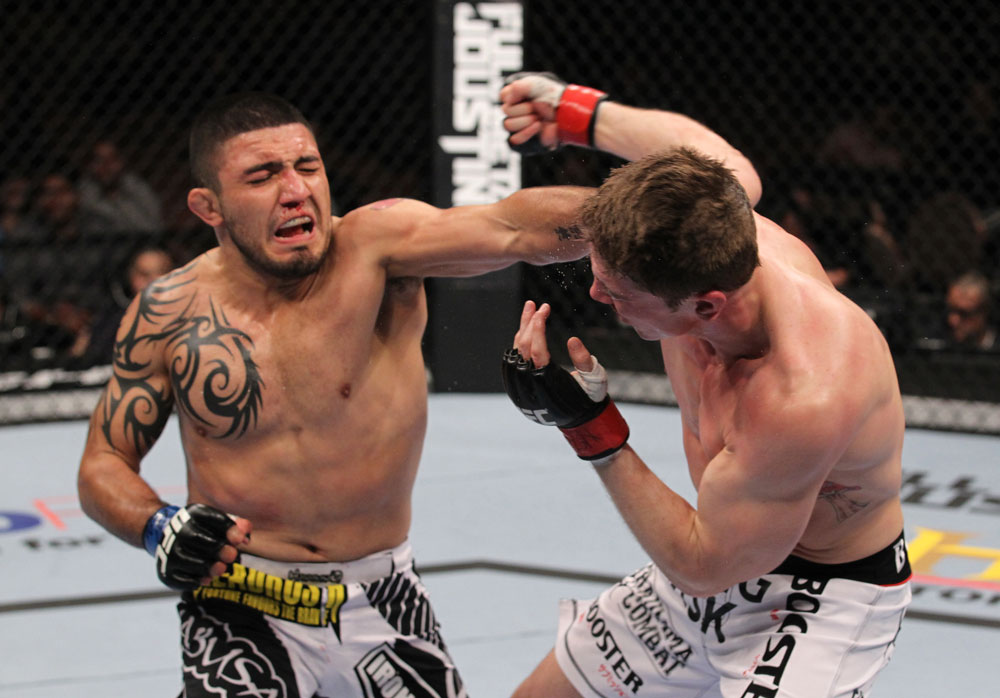 LAS VEGAS, NV - FEBRUARY 04:  (L-R) Henry Martinez punches Matt Riddle during the UFC 143 event at Mandalay Bay Events Center on February 4, 2012 in Las Vegas, Nevada.  (Photo by Nick Laham/Zuffa LLC/Zuffa LLC via Getty Images) *** Local Caption *** Henry Martinez; Matt Riddle