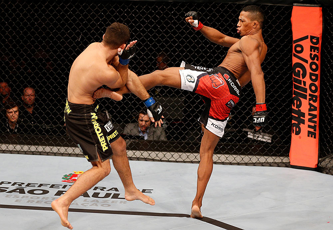 SAO PAULO, BRAZIL - JANUARY 19: (R-L) Yuri Alcantara kicks Pedro Nobre in their bantamweight fight at the UFC on FX event on January 19, 2013 at Ibirapuera Gymnasium in Sao Paulo, Brazil. (Photo by Josh Hedges/Zuffa LLC/Zuffa LLC via Getty Images)