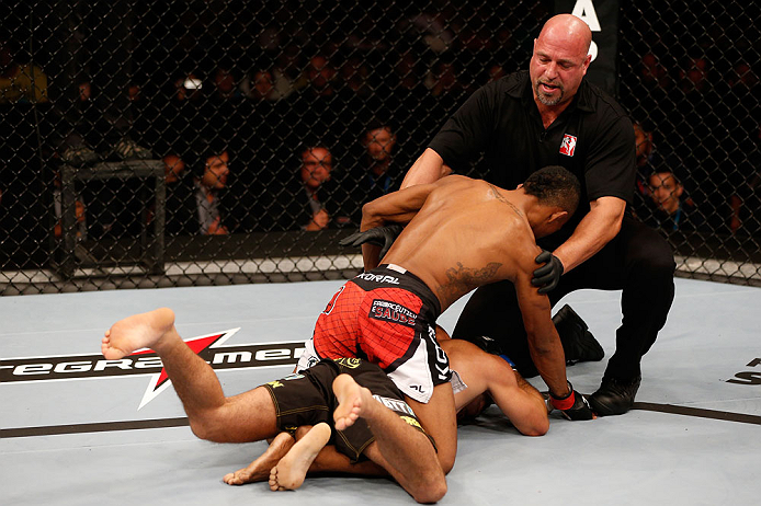 SAO PAULO, BRAZIL - JANUARY 19: (R-L) Referee Dan Miragliotta calls time after an illegal strike by Yuri Alcantara against Pedro Nobre in their bantamweight fight at the UFC on FX event on January 19, 2013 at Ibirapuera Gymnasium in Sao Paulo, Brazil. (Photo by Josh Hedges/Zuffa LLC/Zuffa LLC via Getty Images)