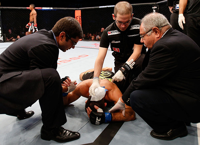 SAO PAULO, BRAZIL - JANUARY 19: Pedro Nobre is treated by doctors after an illegal strike from Yuri Alcantara in their bantamweight fight at the UFC on FX event on January 19, 2013 at Ibirapuera Gymnasium in Sao Paulo, Brazil. (Photo by Josh Hedges/Zuffa LLC/Zuffa LLC via Getty Images)