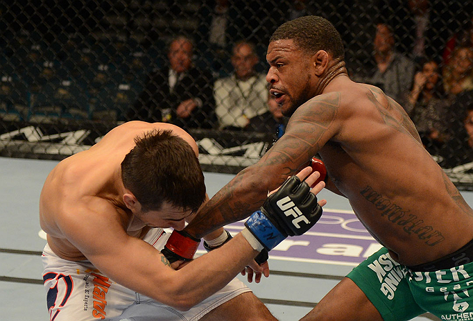 LAS VEGAS, NV - DECEMBER 29:  (R-L) Michael Johnson punches Myles Jury during their lightweight fight at UFC 155 on December 29, 2012 at MGM Grand Garden Arena in Las Vegas, Nevada. (Photo by Josh Hedges/Zuffa LLC/Zuffa LLC via Getty Images) *** Local Caption *** Michael Johnson; Myles Jury