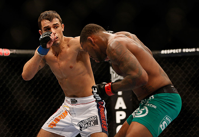 LAS VEGAS, NV - DECEMBER 29:  (L-R) Myles Jury punches Michael Johnson during their lightweight fight at UFC 155 on December 29, 2012 at MGM Grand Garden Arena in Las Vegas, Nevada. (Photo by Josh Hedges/Zuffa LLC/Zuffa LLC via Getty Images) *** Local Caption *** Michael Johnson; Myles Jury