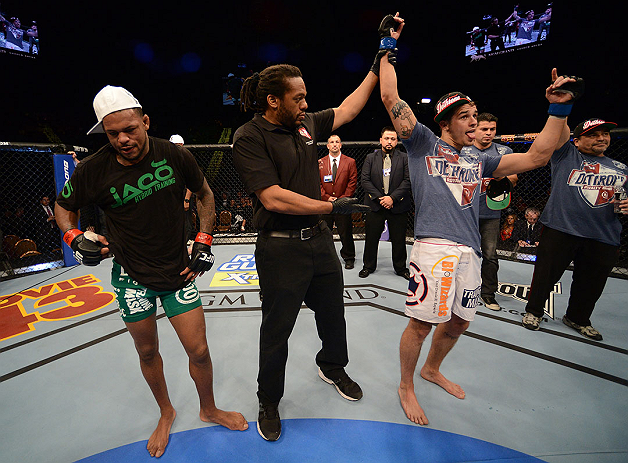 LAS VEGAS, NV - DECEMBER 29:  Myles Jury (right) is declared the winner in his fight against Michael Johnson (left) after their lightweight fight at UFC 155 on December 29, 2012 at MGM Grand Garden Arena in Las Vegas, Nevada. (Photo by Donald Miralle/Zuffa LLC/Zuffa LLC via Getty Images) *** Local Caption *** Michael Johnson; Myles Jury