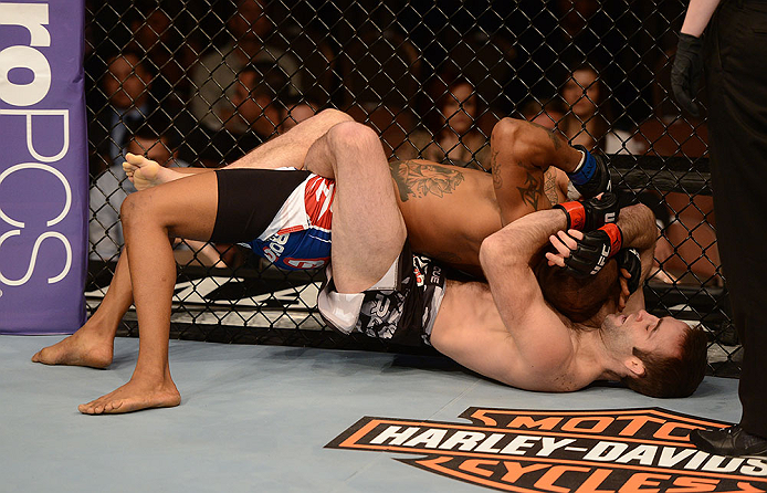 LAS VEGAS, NV - FEBRUARY 02: Jacob Volkmann (bottom) attempts to submit Bobby Green during their lightweight fight at UFC 156 on February 2, 2013 at the Mandalay Bay Events Center in Las Vegas, Nevada. (Photo by Donald Miralle/Zuffa LLC/Zuffa LLC via Getty Images) *** Local Caption *** Jacob Volkmann; Bobby Green