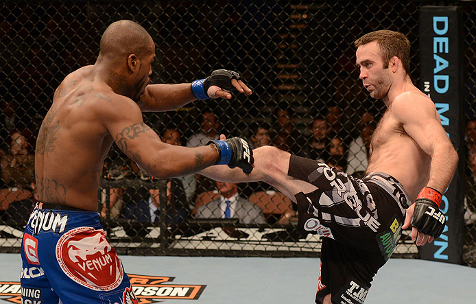 LAS VEGAS, NV - FEBRUARY 02: (R-L) Jacob Volkmann kicks Bobby Green during their lightweight fight at UFC 156 on February 2, 2013 at the Mandalay Bay Events Center in Las Vegas, Nevada. (Photo by Donald Miralle/Zuffa LLC/Zuffa LLC via Getty Images) *** Local Caption *** Jacob Volkmann; Bobby Green