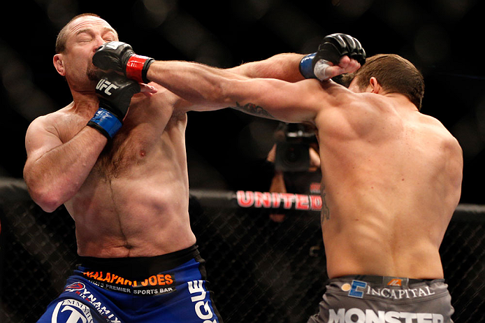 CHICAGO, IL - JANUARY 26:  Vladimir Matyushenko (L) gets punched by Ryan Bader (R) during their Light Heavyweight Bout part of UFC on FOX at United Center on January 26, 2013 in Chicago, Illinois.  (Photo by Josh Hedges/Zuffa LLC/Zuffa LLC Via Getty Images)