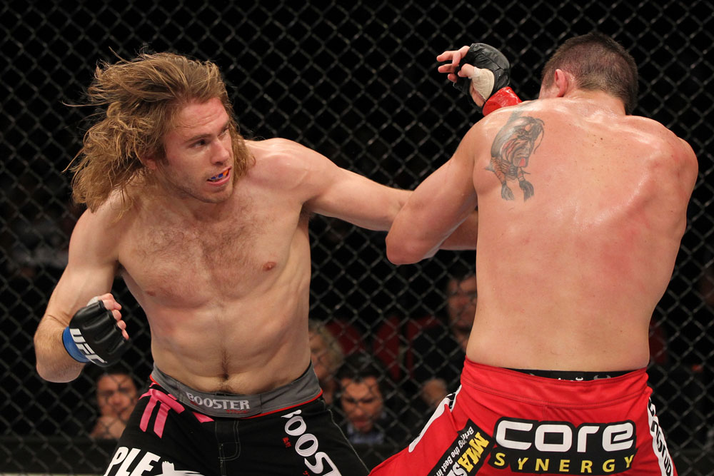 SYDNEY, AUSTRALIA - MARCH 03: (L-R) Andrew Craig punches Kyle Noke during a middleweight bout during the UFC on FX event at Allphones Arena on March 3, 2012 in Sydney, Australia. (Photo by Josh Hedges/Zuffa LLC/Zuffa LLC via Getty Images) *** Local Caption *** Kyle Noke; Andrew Craig