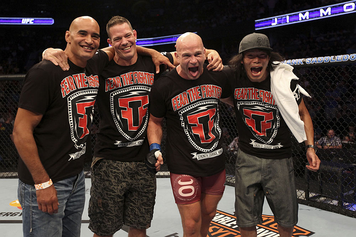 CALGARY, CANADA - JULY 21: Ryan Jimmo (second from right) celebrates with his corner after defeating Anthony Perosh during their light heavyweight bout at UFC 149 inside the Scotiabank Saddledome on July 21, 2012 in Calgary, Alberta, Canada.  (Photo by Nick Laham/Zuffa LLC/Zuffa LLC via Getty Images)