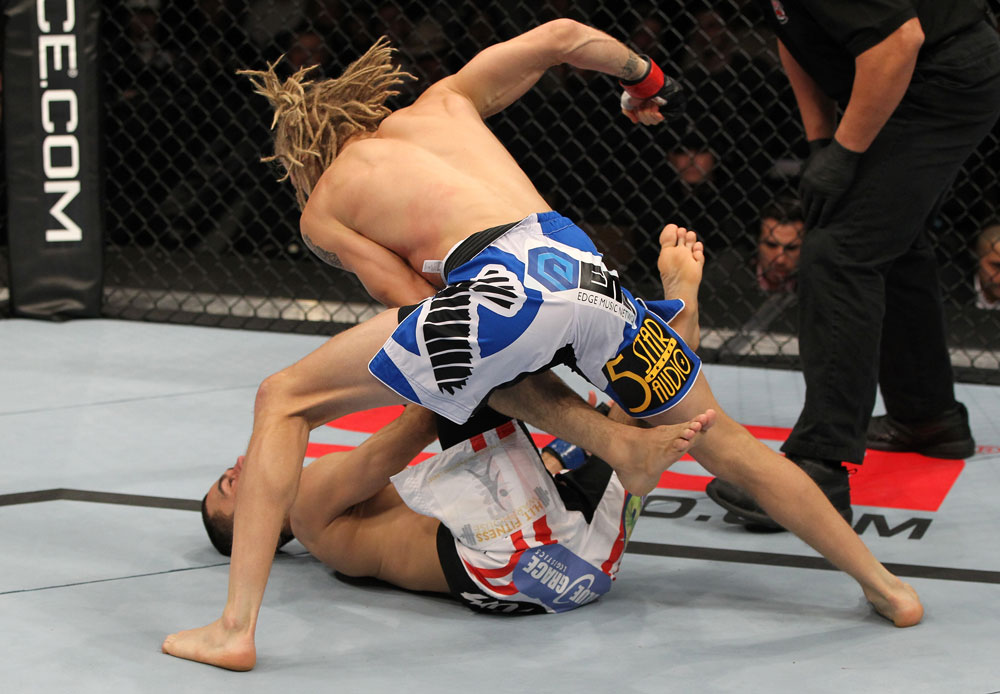 OMAHA, NE - FEBRUARY 15: (R-L) Jonathan Brookins knocks out Vagner Rocha with a punch on the ground during the UFC on FUEL TV event at Omaha Civic Auditorium on February 15, 2012 in Omaha, Nebraska. (Photo by Josh Hedges/Zuffa LLC/Zuffa LLC via Getty Images) *** Local Caption *** Jonathan Brookins; Vagner Rocha