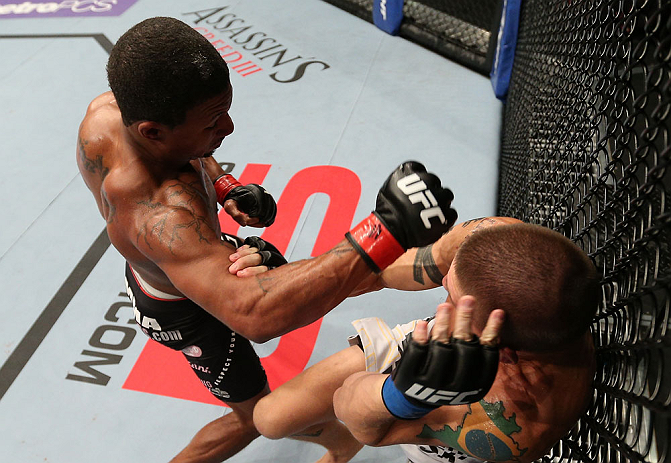 MINNEAPOLIS, MN - OCTOBER 05: (L-R) Marcus LeVesseur punches Carlo Prater during their lightweight fight at the UFC on FX event at Target Center on October 5, 2012 in Minneapolis, Minnesota. (Photo by Josh Hedges/Zuffa LLC/Zuffa LLC via Getty Images)