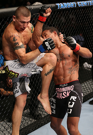MINNEAPOLIS, MN - OCTOBER 05: (R-L) Marcus LeVesseur punches Carlo Prater during their lightweight fight at the UFC on FX event at Target Center on October 5, 2012 in Minneapolis, Minnesota. (Photo by Josh Hedges/Zuffa LLC/Zuffa LLC via Getty Images)