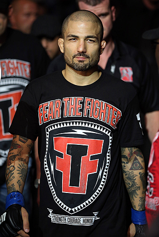 NOTTINGHAM, ENGLAND - SEPTEMBER 29:  Akira Corassani enters the arena before his featherweight fight against Andy Ogle at the UFC on Fuel TV event at Capital FM Arena on September 29, 2012 in Nottingham, England.  (Photo by Josh Hedges/Zuffa LLC/Zuffa LLC via Getty Images)