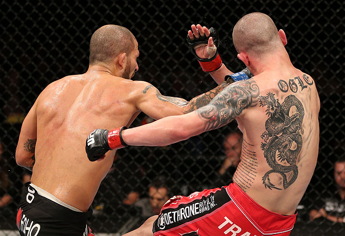 NOTTINGHAM, ENGLAND - SEPTEMBER 29: (L-R) Akira Corassani punches Andy Ogle during their featherweight fight at the UFC on Fuel TV event at Capital FM Arena on September 29, 2012 in Nottingham, England. (Photo by Josh Hedges/Zuffa LLC/Zuffa LLC via Getty Images)