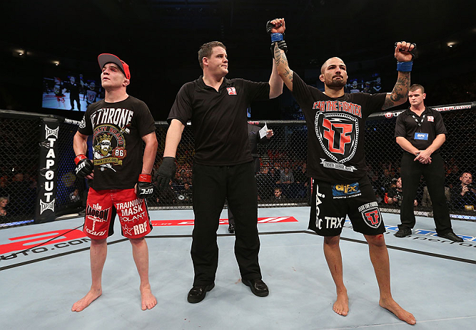 NOTTINGHAM, ENGLAND - SEPTEMBER 29: Akira Corassani (R) reacts after defeating Andy Ogle (L) during their featherweight fight at the UFC on Fuel TV event at Capital FM Arena on September 29, 2012 in Nottingham, England. (Photo by Josh Hedges/Zuffa LLC/Zuffa LLC via Getty Images)