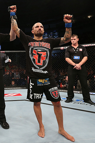 NOTTINGHAM, ENGLAND - SEPTEMBER 29: Akira Corassani reacts after defeating Andy Ogle during their featherweight fight at the UFC on Fuel TV event at Capital FM Arena on September 29, 2012 in Nottingham, England. (Photo by Josh Hedges/Zuffa LLC/Zuffa LLC via Getty Images)