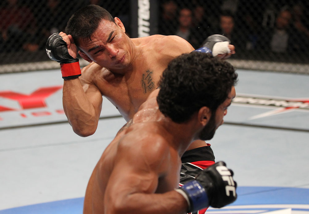 BELO HORIZONTE, BRAZIL - JUNE 23: (R-L) Hugo "Wolverine" Viana punches John Teixeira during their UFC 147 featherweight bout at Estadio Jornalista Felipe Drummond on June 23, 2012 in Belo Horizonte, Brazil. (Photo by Josh Hedges/Zuffa LLC/Zuffa LLC via Getty Images)