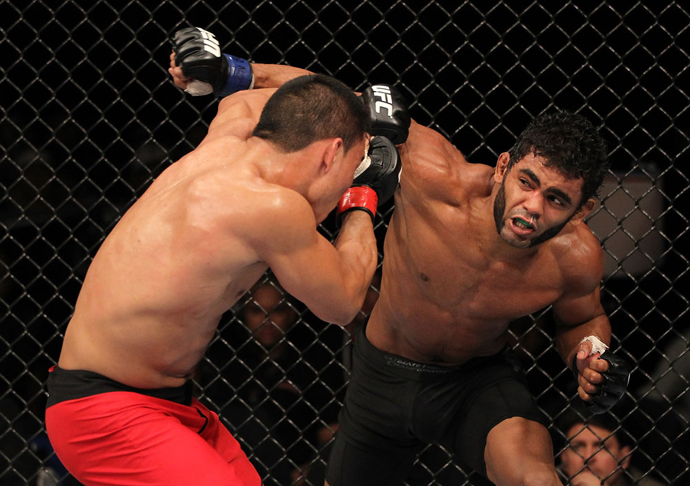 BELO HORIZONTE, BRAZIL - JUNE 23: (R-L) Hugo "Wolverine" Viana punches John Teixeira during their UFC 147 featherweight bout at Estadio Jornalista Felipe Drummond on June 23, 2012 in Belo Horizonte, Brazil. (Photo by Josh Hedges/Zuffa LLC/Zuffa LLC via Getty Images)