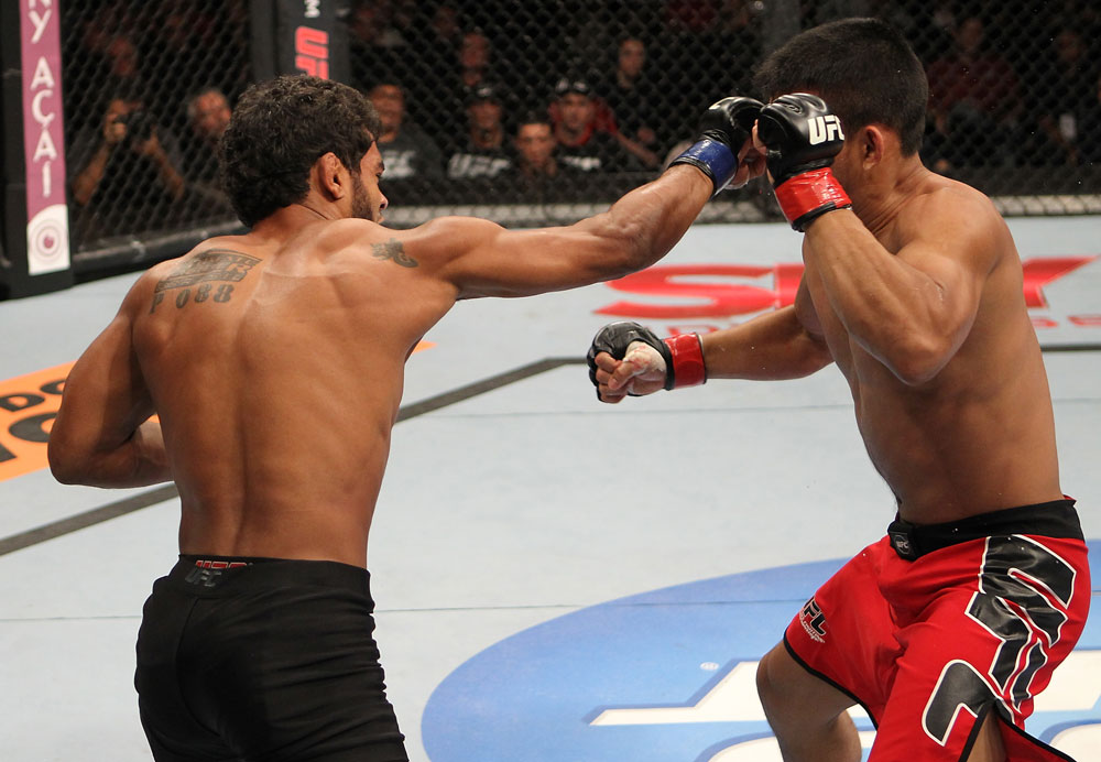 BELO HORIZONTE, BRAZIL - JUNE 23: (L-R) Hugo "Wolverine" Viana punches John Teixeira during their UFC 147 featherweight bout at Estadio Jornalista Felipe Drummond on June 23, 2012 in Belo Horizonte, Brazil. (Photo by Josh Hedges/Zuffa LLC/Zuffa LLC via Getty Images)