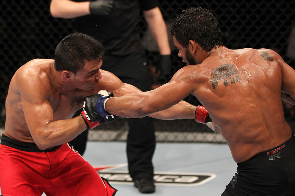 BELO HORIZONTE, BRAZIL - JUNE 23: (R-L) Hugo "Wolverine" Viana punches John Teixeira during their UFC 147 featherweight bout at Estadio Jornalista Felipe Drummond on June 23, 2012 in Belo Horizonte, Brazil. (Photo by Josh Hedges/Zuffa LLC/Zuffa LLC via Getty Images)