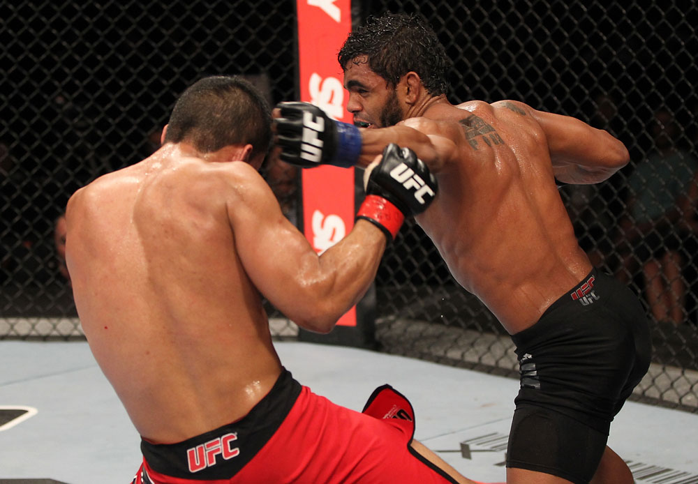 BELO HORIZONTE, BRAZIL - JUNE 23: (R-L) Hugo "Wolverine" Viana punches John Teixeira during their UFC 147 featherweight bout at Estadio Jornalista Felipe Drummond on June 23, 2012 in Belo Horizonte, Brazil. (Photo by Josh Hedges/Zuffa LLC/Zuffa LLC via Getty Images)