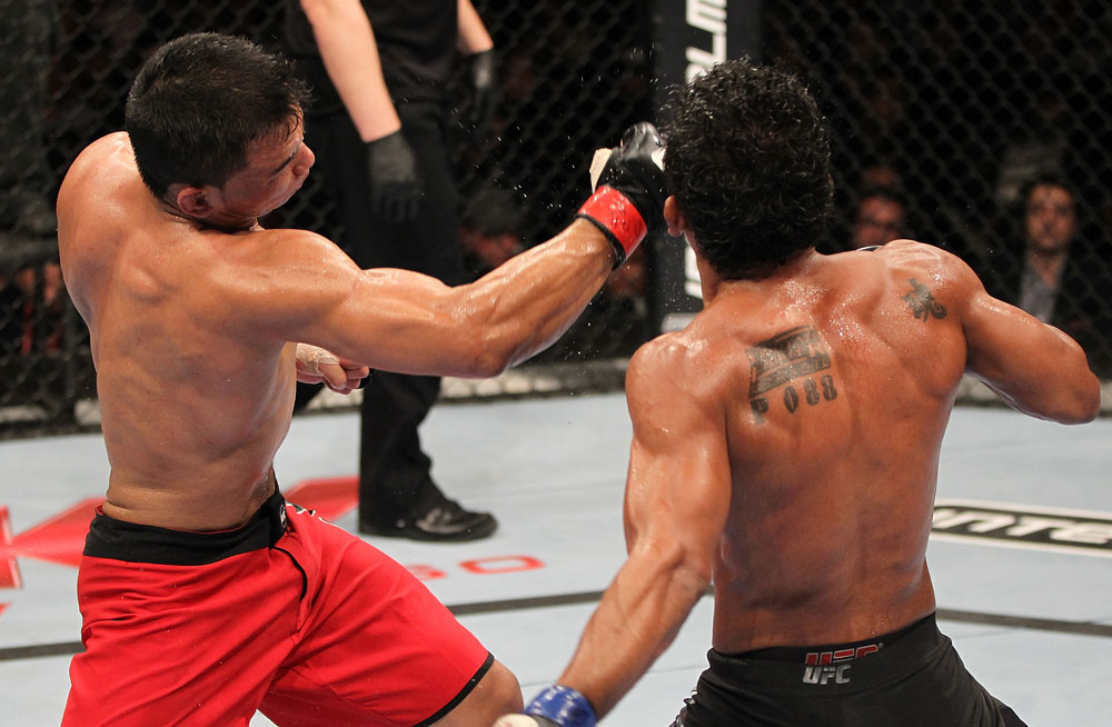 BELO HORIZONTE, BRAZIL - JUNE 23: (L-R) John Teixeira punches Hugo "Wolverine" Viana during their UFC 147 featherweight bout at Estadio Jornalista Felipe Drummond on June 23, 2012 in Belo Horizonte, Brazil. (Photo by Josh Hedges/Zuffa LLC/Zuffa LLC via Getty Images)