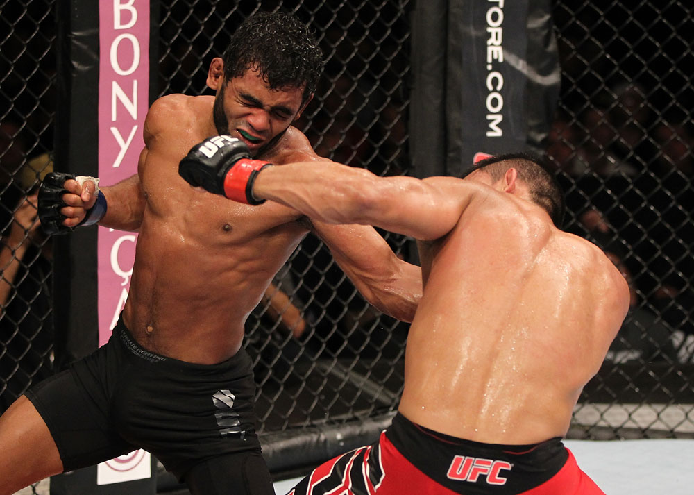 BELO HORIZONTE, BRAZIL - JUNE 23: (L-R) Hugo "Wolverine" Viana punches John Teixeira during their UFC 147 featherweight bout at Estadio Jornalista Felipe Drummond on June 23, 2012 in Belo Horizonte, Brazil. (Photo by Josh Hedges/Zuffa LLC/Zuffa LLC via Getty Images)
