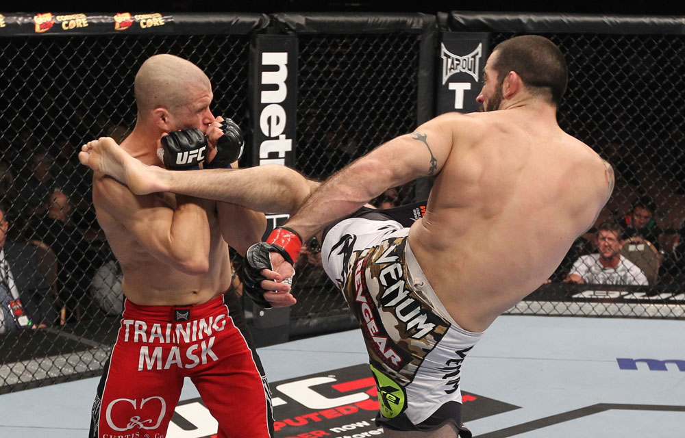 LAS VEGAS, NV - FEBRUARY 04:  Matt Brown (right) kicks Chris Cope during the UFC 143 event at Mandalay Bay Events Center on February 4, 2012 in Las Vegas, Nevada.  (Photo by Nick Laham/Zuffa LLC/Zuffa LLC via Getty Images) *** Local Caption *** Matt Brown; Chris Cope