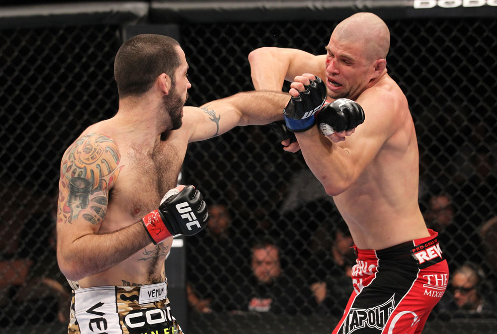 LAS VEGAS, NV - FEBRUARY 04:  Matt Brown (left) punches Chris Cope during the UFC 143 event at Mandalay Bay Events Center on February 4, 2012 in Las Vegas, Nevada.  (Photo by Nick Laham/Zuffa LLC/Zuffa LLC via Getty Images) *** Local Caption *** Matt Brown
