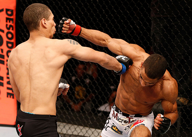 SAO PAULO, BRAZIL - JANUARY 19: (R-L) Edson Barboza punches Lucas Martins in their lightweight fight at the UFC on FX event on January 19, 2013 at Ibirapuera Gymnasium in Sao Paulo, Brazil. (Photo by Josh Hedges/Zuffa LLC/Zuffa LLC via Getty Images)