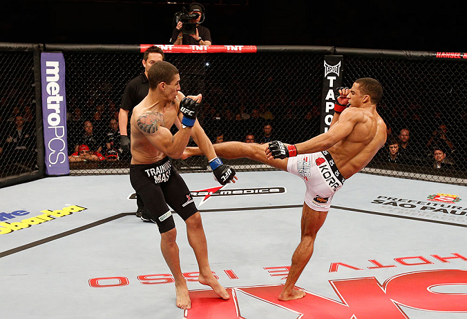 SAO PAULO, BRAZIL - JANUARY 19: (R-L) Edson Barboza kicks Lucas Martins in their lightweight fight at the UFC on FX event on January 19, 2013 at Ibirapuera Gymnasium in Sao Paulo, Brazil. (Photo by Josh Hedges/Zuffa LLC/Zuffa LLC via Getty Images)