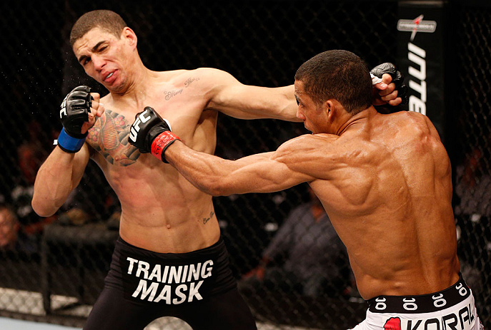 SAO PAULO, BRAZIL - JANUARY 19: (R-L) Edson Barboza punches Lucas Martins in their lightweight fight at the UFC on FX event on January 19, 2013 at Ibirapuera Gymnasium in Sao Paulo, Brazil. (Photo by Josh Hedges/Zuffa LLC/Zuffa LLC via Getty Images)