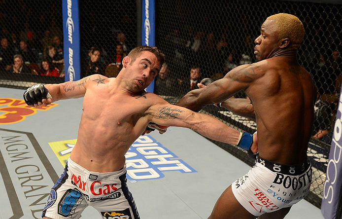 LAS VEGAS, NV - DECEMBER 29:  (L-R) Jamie Varner punches Melvin Guillard during their lightweight fight at UFC 155 on December 29, 2012 at MGM Grand Garden Arena in Las Vegas, Nevada. (Photo by Donald Miralle/Zuffa LLC/Zuffa LLC via Getty Images) *** Local Caption *** Melvin Guillard; Jamie Varner