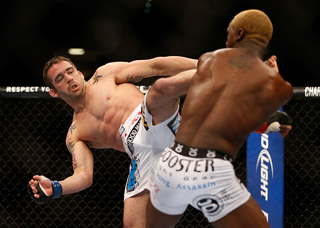 LAS VEGAS, NV - DECEMBER 29:  (L-R) Jamie Varner kicks Melvin Guillard during their lightweight fight at UFC 155 on December 29, 2012 at MGM Grand Garden Arena in Las Vegas, Nevada. (Photo by Josh Hedges/Zuffa LLC/Zuffa LLC via Getty Images) *** Local Caption *** Melvin Guillard; Jamie Varner