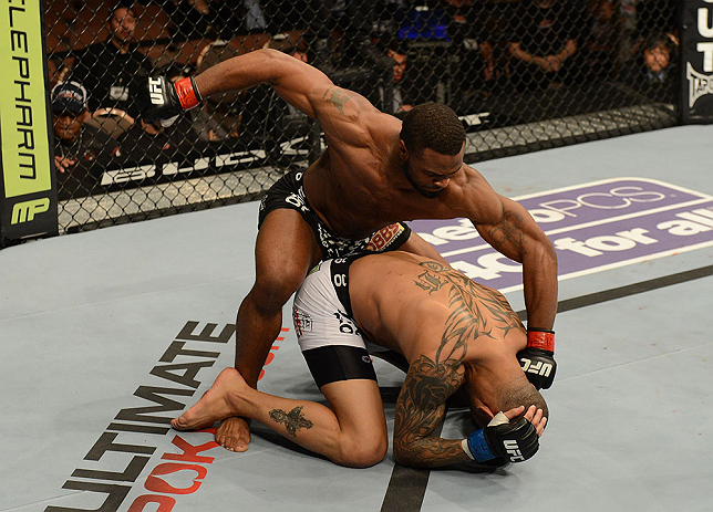 LAS VEGAS, NV - FEBRUARY 02: Tyron Woodley (top) punches Jay Hieron during their welterweight fight at UFC 156 on February 2, 2013 at the Mandalay Bay Events Center in Las Vegas, Nevada. (Photo by Donald Miralle/Zuffa LLC/Zuffa LLC via Getty Images) *** Local Caption *** Jay Hieron; Tyron Woodley