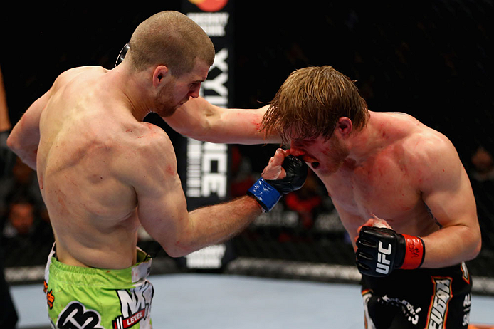 CHICAGO, IL - JANUARY 26:  Pascal Krauss (L) punches Mike Stumpf (R) during their Welterweight Bout part of UFC on FOX at United Center on January 26, 2013 in Chicago, Illinois.  (Photo by Al Bello/Zuffa LLC/Zuffa LLC Via Getty Images)