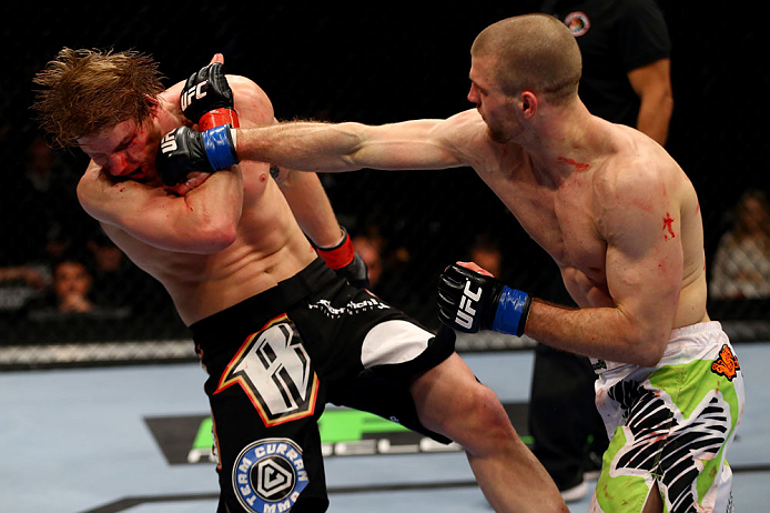 CHICAGO, IL - JANUARY 26:  Pascal Krauss (R) punches Mike Stumpf (L) during their Welterweight Bout part of UFC on FOX at United Center on January 26, 2013 in Chicago, Illinois.  (Photo by Al Bello/Zuffa LLC/Zuffa LLC Via Getty Images)