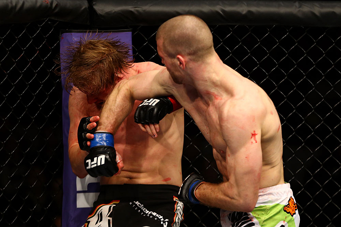 CHICAGO, IL - JANUARY 26:  Pascal Krauss (R) punches Mike Stumpf (L) during their Welterweight Bout part of UFC on FOX at United Center on January 26, 2013 in Chicago, Illinois.  (Photo by Al Bello/Zuffa LLC/Zuffa LLC Via Getty Images)