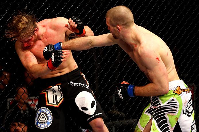 CHICAGO, IL - JANUARY 26:  Pascal Krauss (R) punches Mike Stumpf (L) during their Welterweight Bout part of UFC on FOX at United Center on January 26, 2013 in Chicago, Illinois.  (Photo by Al Bello/Zuffa LLC/Zuffa LLC Via Getty Images)