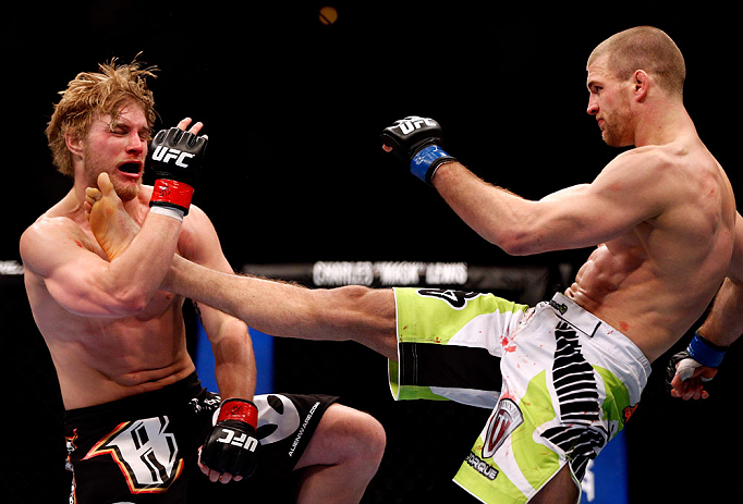 CHICAGO, IL - JANUARY 26:  Pascal Krauss (L) kicks Mike Stumpf (R) during their Welterweight Bout part of UFC on FOX at United Center on January 26, 2013 in Chicago, Illinois.  (Photo by Josh Hedges/Zuffa LLC/Zuffa LLC Via Getty Images)