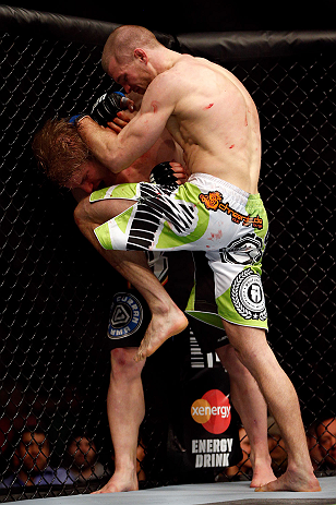 CHICAGO, IL - JANUARY 26:  Pascal Krauss (R) knees Mike Stumpf (L) during their Welterweight Bout part of UFC on FOX at United Center on January 26, 2013 in Chicago, Illinois.  (Photo by Josh Hedges/Zuffa LLC/Zuffa LLC Via Getty Images)