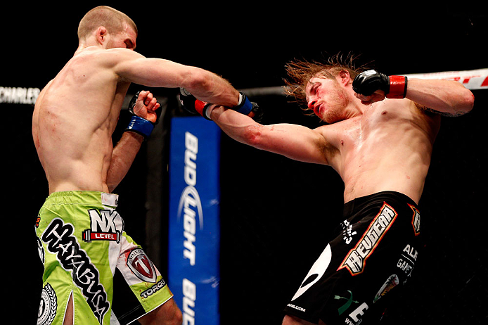CHICAGO, IL - JANUARY 26:  Pascal Krauss (L) punches Mike Stumpf (R) during their Welterweight Bout part of UFC on FOX at United Center on January 26, 2013 in Chicago, Illinois.  (Photo by Josh Hedges/Zuffa LLC/Zuffa LLC Via Getty Images)