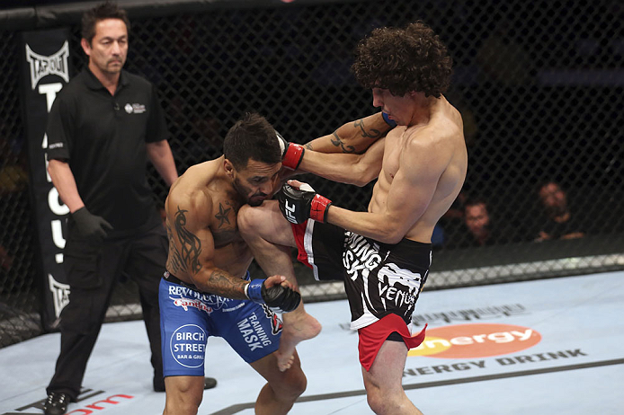 CALGARY, CANADA - JULY 21: (R-L) Roland Delorme lands a knee to the chin of Francisco Rivera during their bantamweight bout at UFC 149 inside the Scotiabank Saddledome on July 21, 2012 in Calgary, Alberta, Canada.  (Photo by Nick Laham/Zuffa LLC/Zuffa LLC via Getty Images)