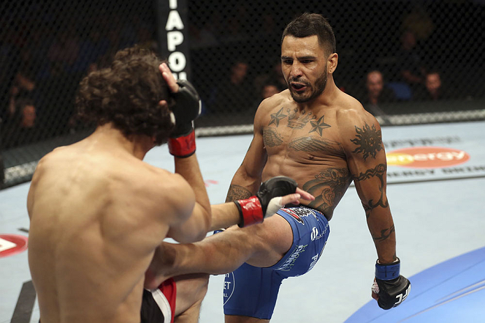 CALGARY, CANADA - JULY 21: (R-L) Francisco Rivera lands a kick to Roland Delorme during their bantamweight bout at UFC 149 inside the Scotiabank Saddledome on July 21, 2012 in Calgary, Alberta, Canada.  (Photo by Nick Laham/Zuffa LLC/Zuffa LLC via Getty Images)