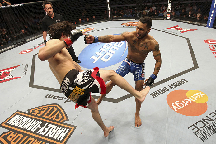 CALGARY, CANADA - JULY 21:  (R-L) Francisco Rivera lands a punch to the head of Roland Delorme during their bantamweight bout at UFC 149 inside the Scotiabank Saddledome on July 21, 2012 in Calgary, Alberta, Canada.  (Photo by Nick Laham/Zuffa LLC/Zuffa LLC via Getty Images)