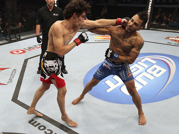CALGARY, CANADA - JULY 21:  (R-L) Francisco Rivera lands a punch to the head of Roland Delorme during their bantamweight bout at UFC 149 inside the Scotiabank Saddledome on July 21, 2012 in Calgary, Alberta, Canada.  (Photo by Nick Laham/Zuffa LLC/Zuffa LLC via Getty Images)